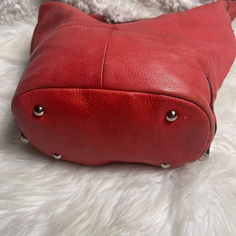 B Makowsky leather orange Hobo bucket style shoulder bag  silver tone hardwares